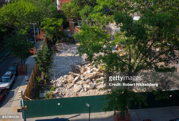 Concrete rubble lies in a pile at a site of a former Long Island College Hospital building recently demolished June 18, 2017 in Brooklyn, New York....