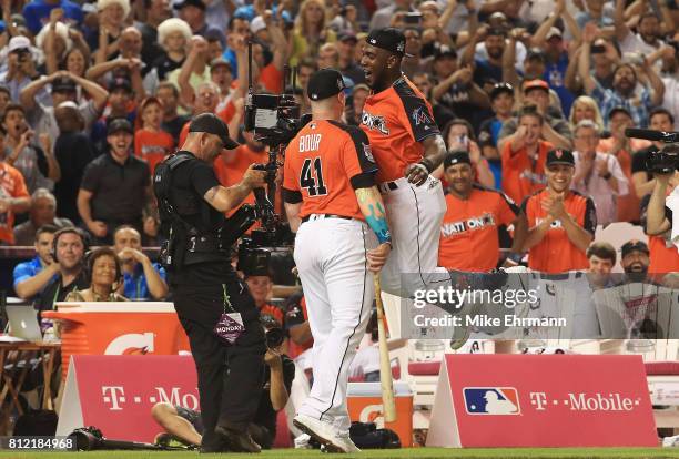 Justin Bour of the Miami Marlins celebrates with Marcell Ozuna of the Miami Marlins and the National League during the T-Mobile Home Run Derby at...