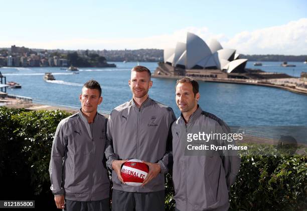 Laurent Koscielny, Per Mertesacker and Petr Cech pose in front of the Sydney Opera House during an Official Welcome to Sydney for Arsenal FC at...