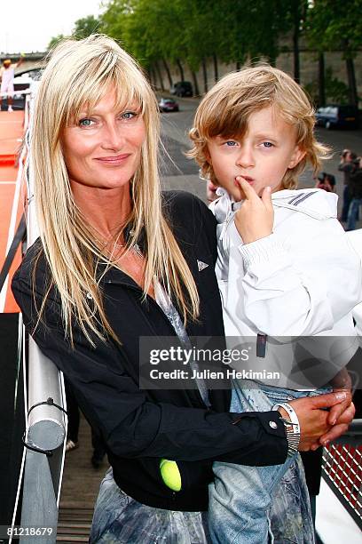 Isabelle Noah and her son Joalukas pose on a boat under the Eiffel Tower on May 23, 2008 in Paris, France. Noah and Wilander had a rematch to...