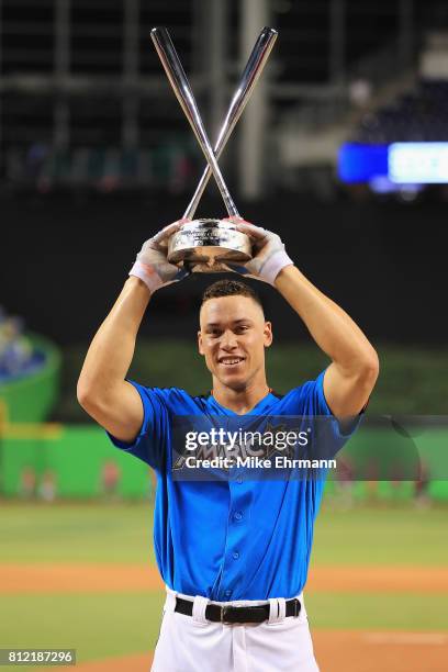 Aaron Judge of the New York Yankees celebrates with the trophy after winning the T-Mobile Home Run Derby at Marlins Park on July 10, 2017 in Miami,...