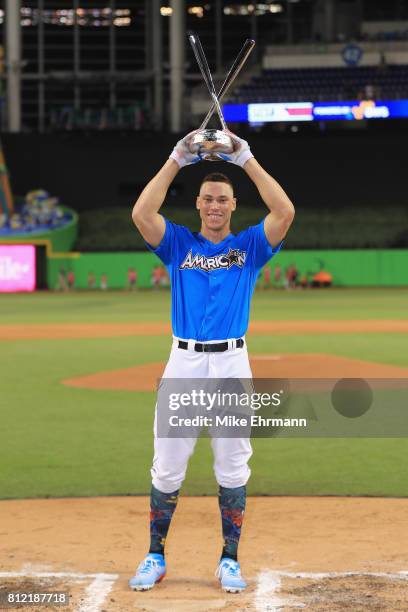 Aaron Judge of the New York Yankees celebrates with the trophy after winning the T-Mobile Home Run Derby at Marlins Park on July 10, 2017 in Miami,...
