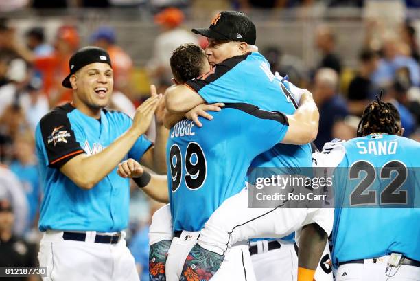 Aaron Judge of the New York Yankees celebrates with Danilo Valiente after winning the T-Mobile Home Run Derby at Marlins Park on July 10, 2017 in...