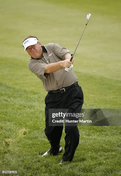 Joey Sindelar hits his third shot on the 13th hole during the second round of the 69th Senior PGA Championship at Oak Hill Country Club - East Course...