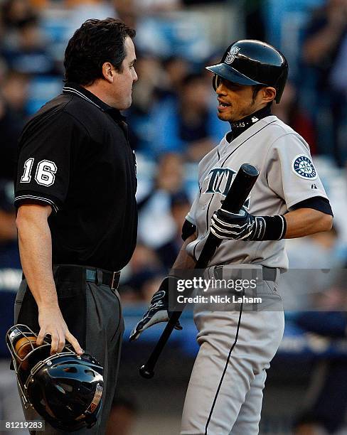 Ichiro Suzuki of the Seattle Mariners argues a strike out call with home plate umpire Mike DiMuro against the New York Yankees at Yankee Stadium May...