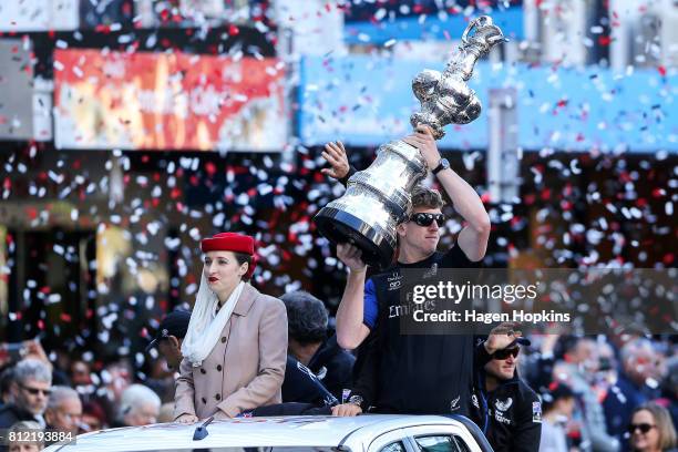 Helmsman, Peter Burling, holds the Americas Cup during the Team New Zealand Americas Cup Wellington Welcome Home Parade on July 11, 2017 in...