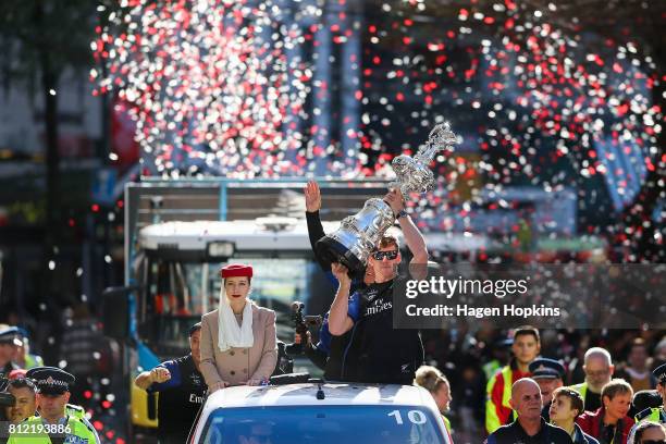 Helmsman, Peter Burling, holds the Americas Cup during the Team New Zealand Americas Cup Wellington Welcome Home Parade on July 11, 2017 in...