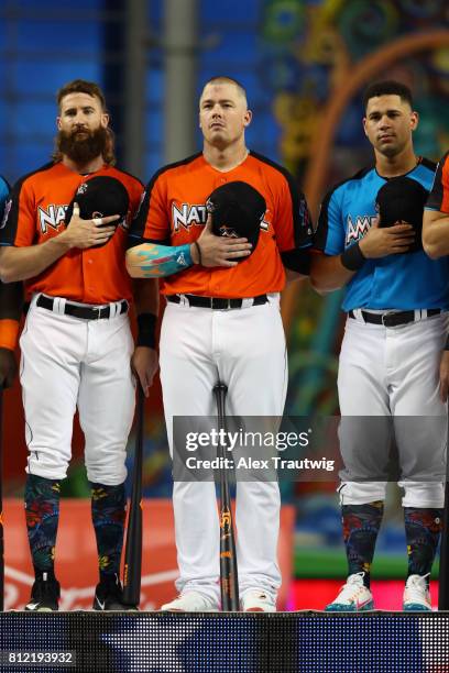 Charlie Blackmon of the Colorado Rockies, Justin Bour of the Miami Marlins and Gary Sanchez of the New York Yankees look on during the National...