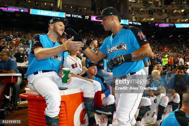 Gary Sanchez of the New York Yankees is congratulated by Chris Sale of the Boston Red Sox during the 2017 T-Mobile Home Run Derby at Marlins Park on...
