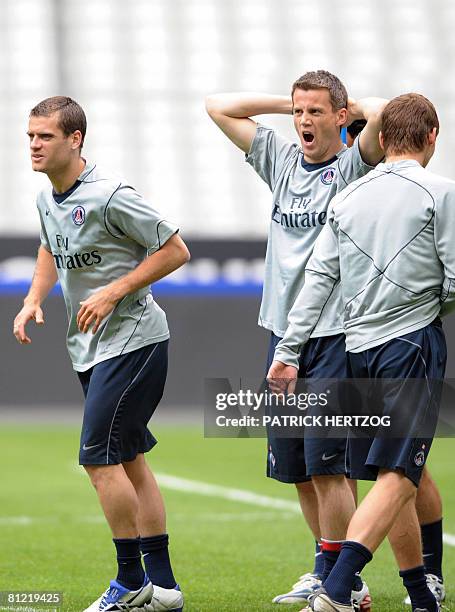 Paris Saint-Germain French midfielder Jerome Rothen and goalkeeper Mickael Landreau practice during a training session at the Stade de France in...