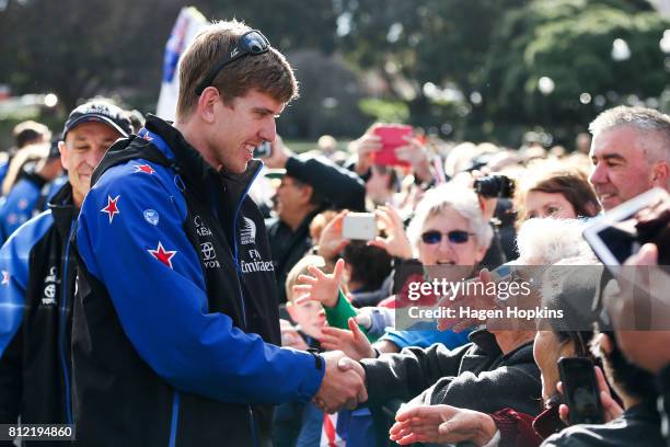 Helmsman, Peter Burling, speaks to fans during the Team New Zealand Americas Cup Wellington Welcome Home Parade on July 11, 2017 in Wellington, New...