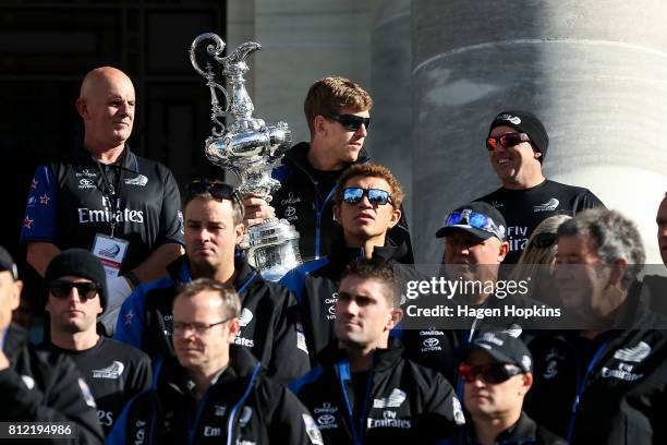 Helmsman, Peter Burling, holds the Americas Cup during the Team New Zealand Americas Cup Wellington Welcome Home Parade on July 11, 2017 in...