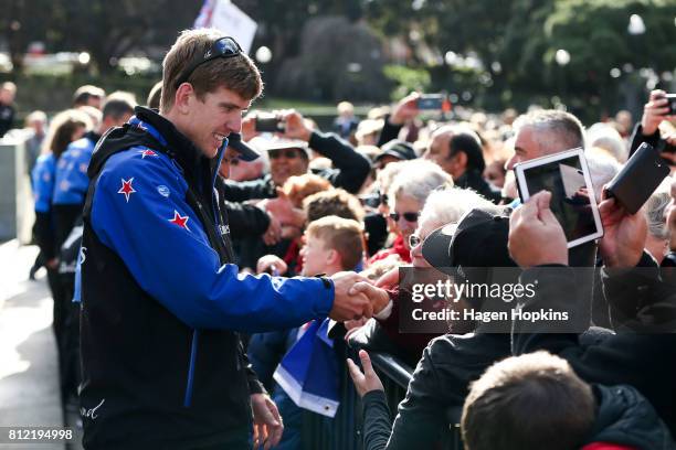 Helmsman, Peter Burling, speaks to fans during the Team New Zealand Americas Cup Wellington Welcome Home Parade on July 11, 2017 in Wellington, New...