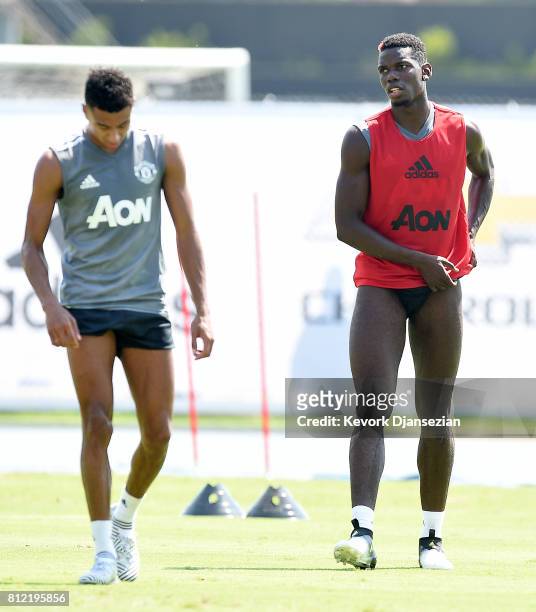 Midfielders Paul Pogba and Jesse Lingard of manchester United take break from training for Tour 2017 at UCLA's Drake Stadium July 10 in Los Angeles,...