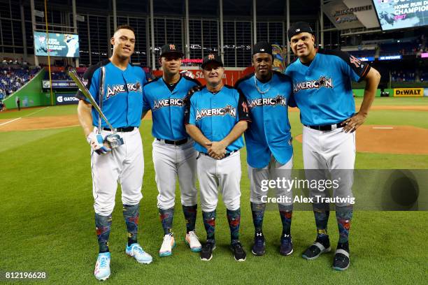 Aaron Judge of the New York Yankees poses with Yankees teammates and Danilo Valiente after winning the 2017 T-Mobile Home Run Derby at Marlins Park...