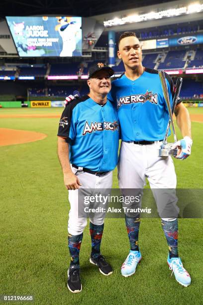 Aaron Judge of the New York Yankees poses with his pitcher Danilo Valiente after winning the 2017 T-Mobile Home Run Derby at Marlins Park on Monday,...