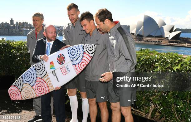New South Wales Minister for Trade and Industry Niall Blair presents Arsenal football players Petr Cech Laurent Koscielny , Per Mertesacker and...