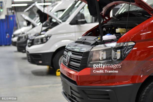 modern delivery vans on the service point - volkswagen stock pictures, royalty-free photos & images