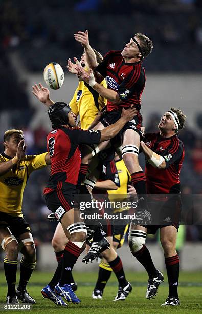 Jason Eaton of the Hurricanes and Brad Thorn of the Crusaders compete for the ball during the Super 14 semi-final match between the Crusaders and the...