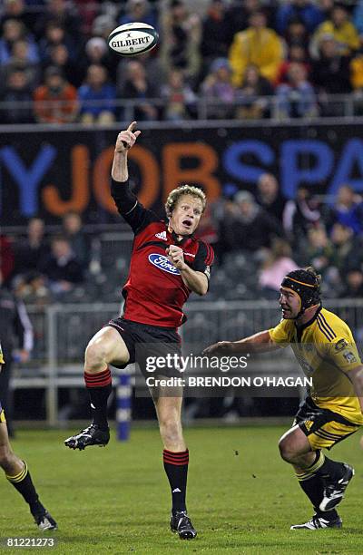 Canterbury Crusaders Scott Hamilton hits the ball back against the Wellington Hurricanes in their Super 14 rugby semi-final match at AMI Stadium in...