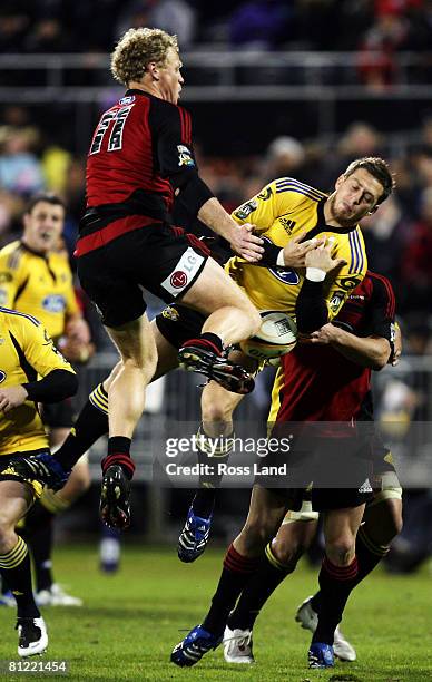 Jimmy Gopperth of the Hurricanes and Scott Hamilton of the Crusaders compete for high ball during the Super 14 semi-final match between the Crusaders...