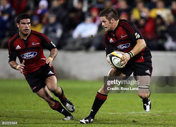 Richie McCaw of the Crusaders looks to pass the ball during the Super 14 semi-final match between the Crusaders and the Hurricanes at AMI Stadium on...