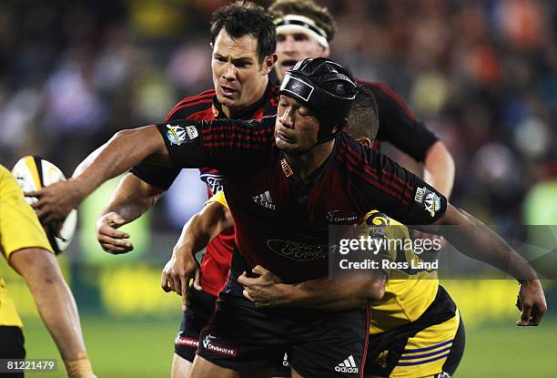Mose Tuiali'i of the Crusaders offloads the ball during the Super 14 semi-final match between the Crusaders and the Hurricanes at AMI Stadium on May...