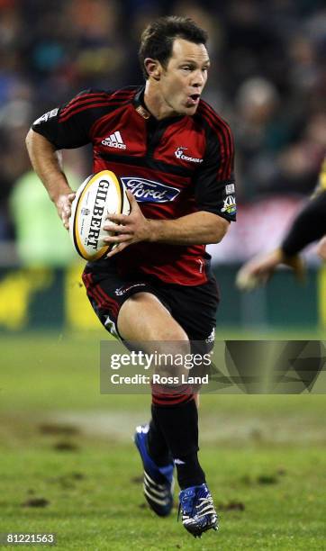 Leon MacDonald of the Crusaders runs the ball during the Super 14 semi-final match between the Crusaders and the Hurricanes at AMI Stadium on May 24,...