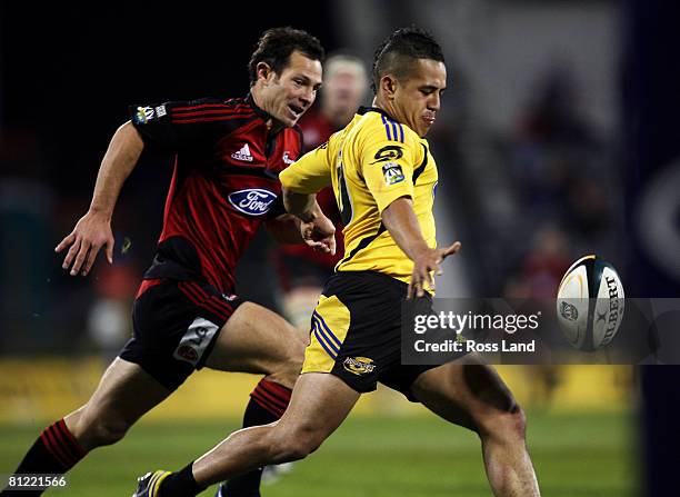Leon MacDonald of the Crusaders chases Willie Ripia of the Hurricanes during the Super 14 semi-final match between the Crusaders and the Hurricanes...