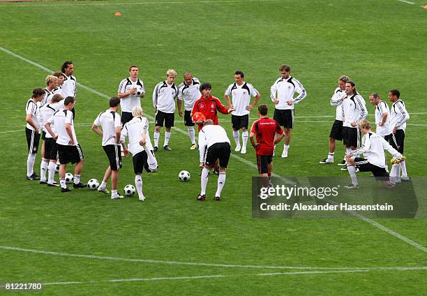 Joachim Loew , head coach of the German national team, gives instructions to his players during training session at the Son Moix stadium on May 24,...