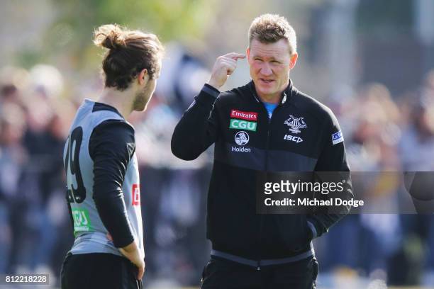 Collingwood Magpies AFL coach Nathan Buckley speaks to Tim Broomhead during a Collingwood Magpies AFL training at the Holden Centre on July 11, 2017...