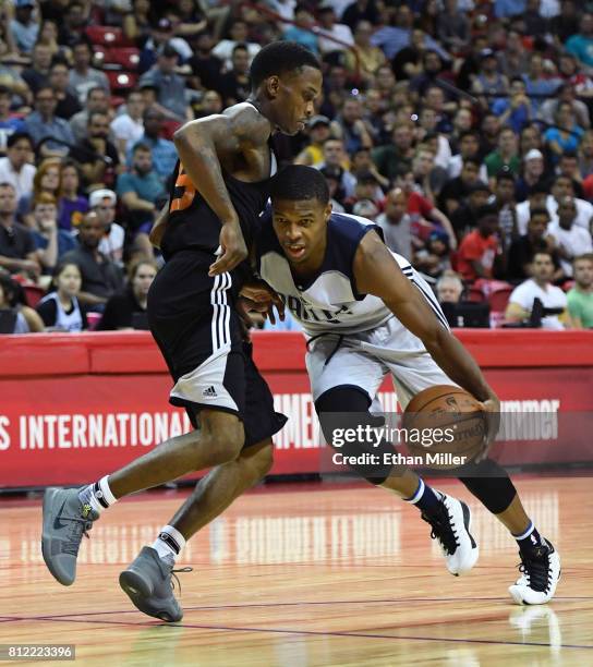 Joe Jackson of the Phoenix Suns guards Dennis Smith Jr. #1 of the Dallas Mavericks during the 2017 Summer League at the Thomas & Mack Center on July...