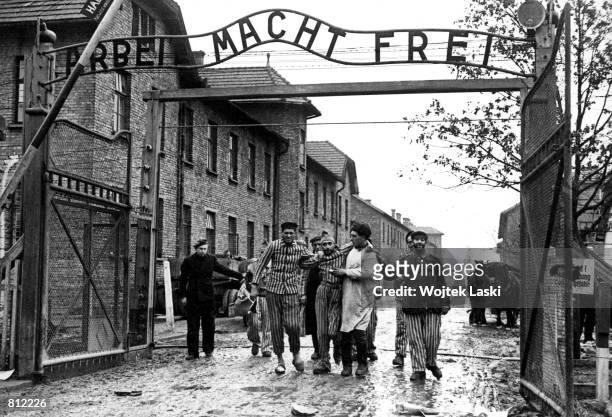 Concentration camp victims are led through the Auschwitz-Birkenau camp gate in 1945 in this photo found recently in Moscow. Auschwitz, which is known...