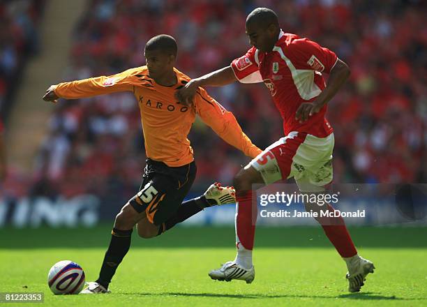 Marvin Elliott of Bristol City battles with Fraizer Campbell of Hull City during the Coca Cola Championship Playoff Final match between Hull City and...