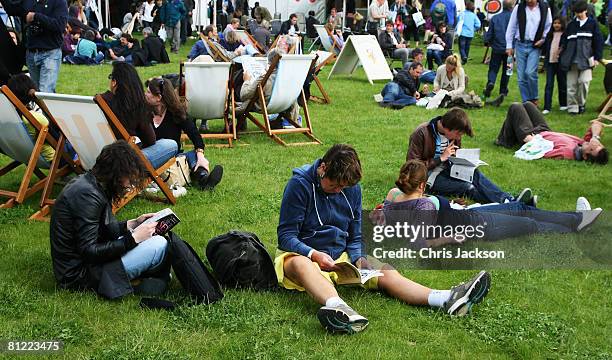 People relax in a deck chairs and read books during the Hay on Wye Literary Festival 2008 on May 24, 2008 in Hay on Wye, Wales. This is the first day...