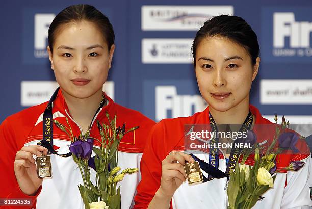 Wu Min Xia and Guo Jing Jing of the People's Republic of China hold their gold medals after winning the Women's 3m Synchro during the 2nd FINA Diving...