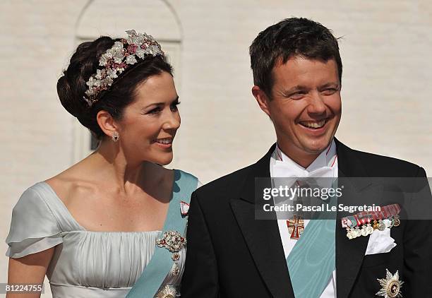 Crown Prince Frederik and Crown Princess Mary of Denmark arrive to attend the wedding between his brother Prince Joachim of Denmark and Marie...