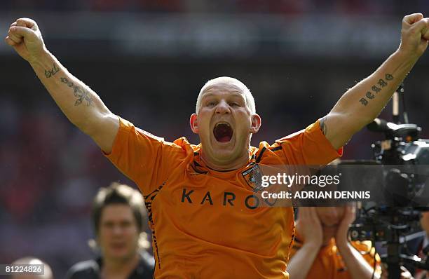 Hull City's Dean Windass reacts in front of fans while celebrating his team's victory over Bristol City during the Football League Championship...