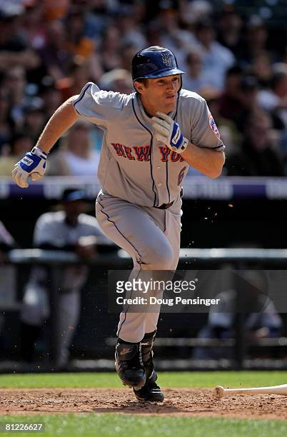 Nick Evans of the New York Mets heads leaves the plate with an RBI double against the Colorado Rockies to give the Mets a 7-2 lead in the eighth...