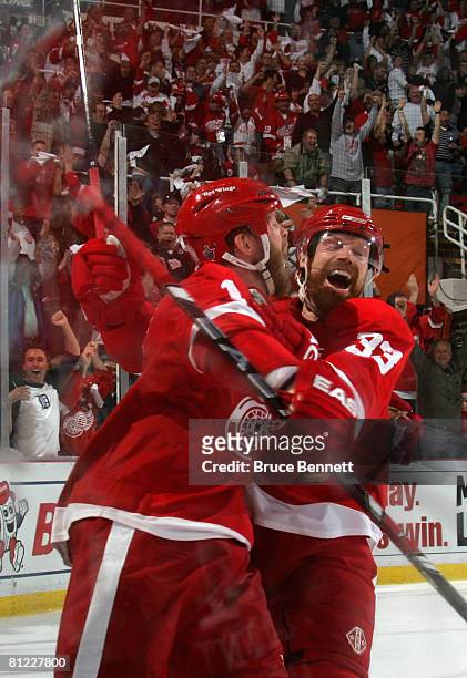 Daniel Cleary of the Detroit Red Wings celebrates with Kris Draper after Cleary scored a shorthanded third period goal against the Pittsburgh...