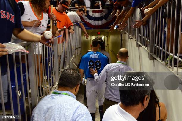 Aaron Judge of the New York Yankees walks backs into the clubhouse after winning the the 2017 T-Mobile Home Run Derby at Marlins Park on Monday, July...