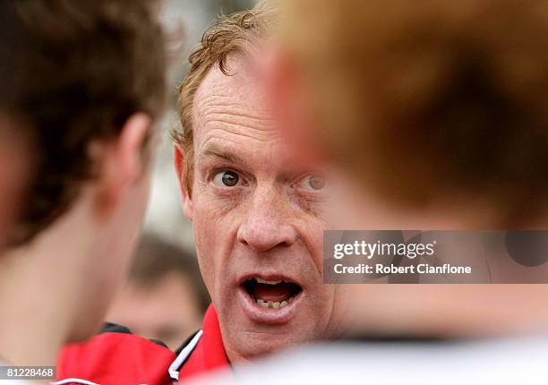 Bombers coach Adrian Hickmott talks to his players at quarter time during the round eight VFL match between the Coburg Tigers and the Bendigo Bombers...