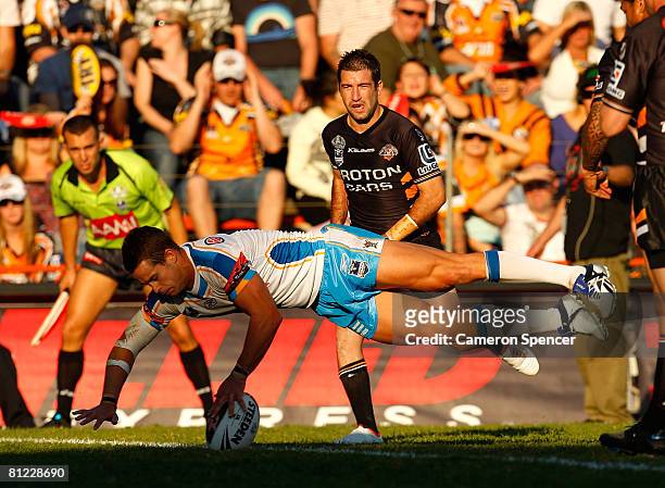 Ashley Harrison of the Titans attempts to score during the round 11 NRL match between the Wests Tigers and the Gold Coast Titans at Leichhardt Oval...