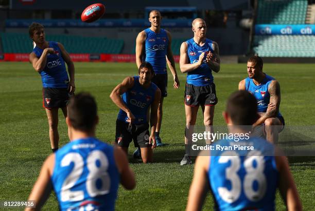 Kieren Jack, Josh Kennedy, Sam Reid, Zak Jones and Lance Franklin of the Swans train during a Sydney Swans AFL training session at Sydney Cricket...