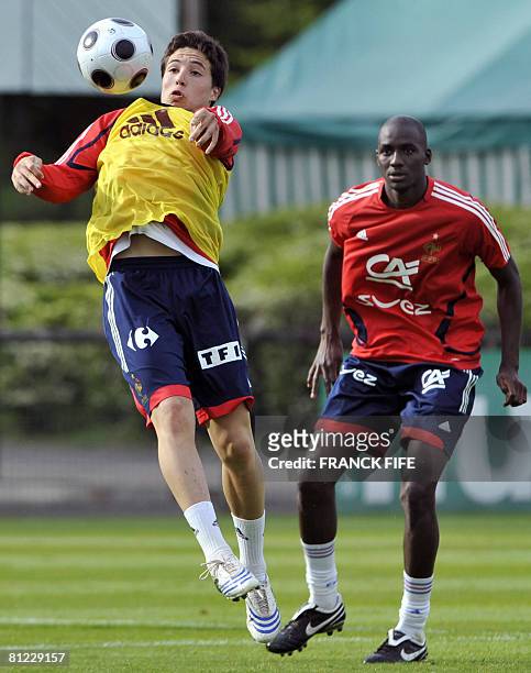 French midfielder Samir Nasri vies with Alou Diarra during a training session in Clairefontaine, southern Paris, on May 23 on the sideline of the...