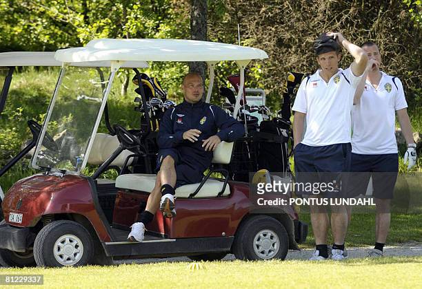 Swedish teamcaptain Fredrik Ljungberg is pictured in the golf cart next to Anders Svensson and Daniel Andersson on the 1st tee when the players...