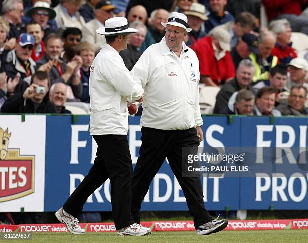 Umpires Simon Taufel and Daryl Hair take to the field at the start of the third day of the second cricket test match between New Zealand and England...