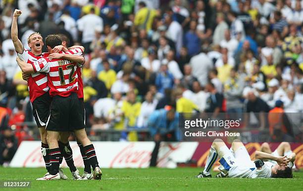 James Hayter of Doncaster Rovers and team mates celebrate victory as Leeds United players are dejected following the Coca Cola League 1 Playoff Final...