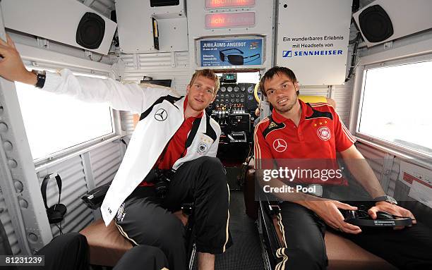 Per Mertesacker und Heiko Westermann sit in a plane of Typ JU 52 during a round fly sponsored by watch manufactrer WC Schaffhausen on May 25, 2008 in...