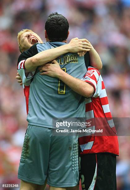 Neil Sullivan of Doncaster Rovers celebrates victory with Adam Lockwood and James O'Connor following the Coca Cola League 1 Playoff Final match...